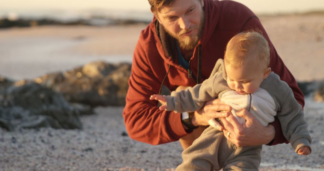 Joyful Father and Toddler Bonding on Beach at Sunset - Free Images, Stock Photos and Pictures on Pikwizard.com