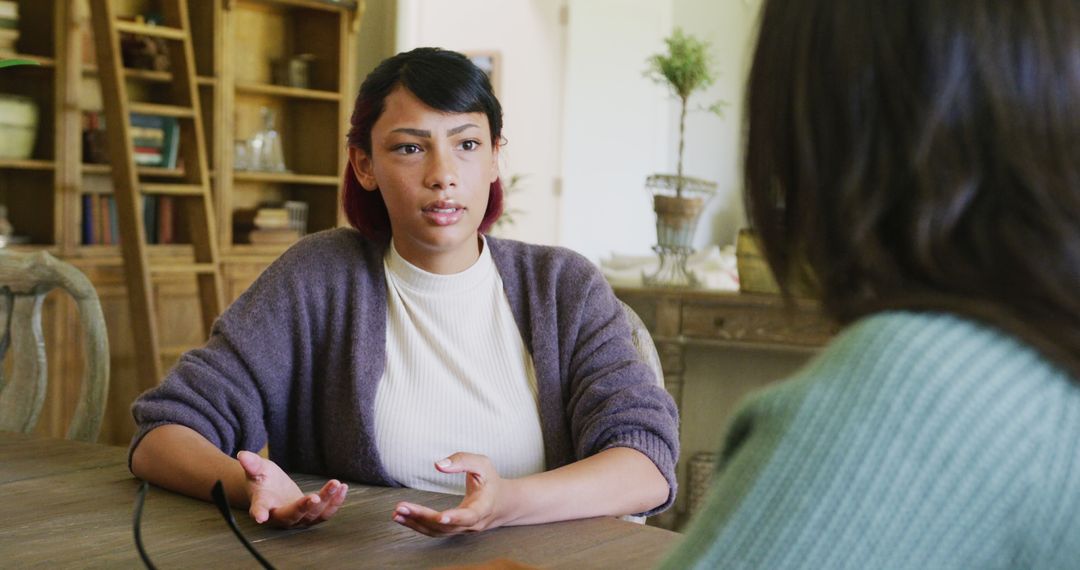 Woman Discussing in Casual Setting with Friend at Home - Free Images, Stock Photos and Pictures on Pikwizard.com