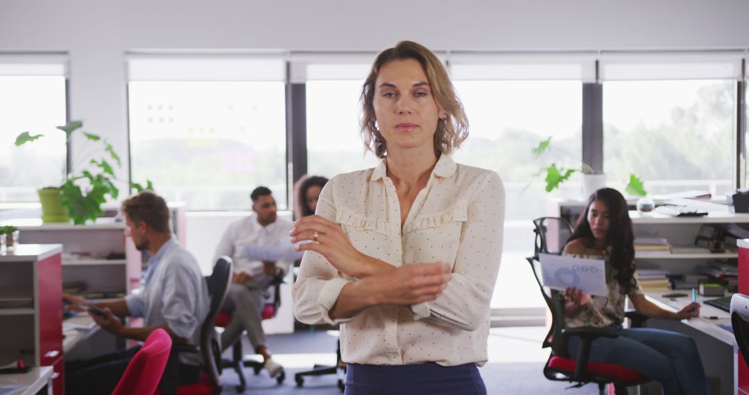 Confident Businesswoman in Modern Office with Team