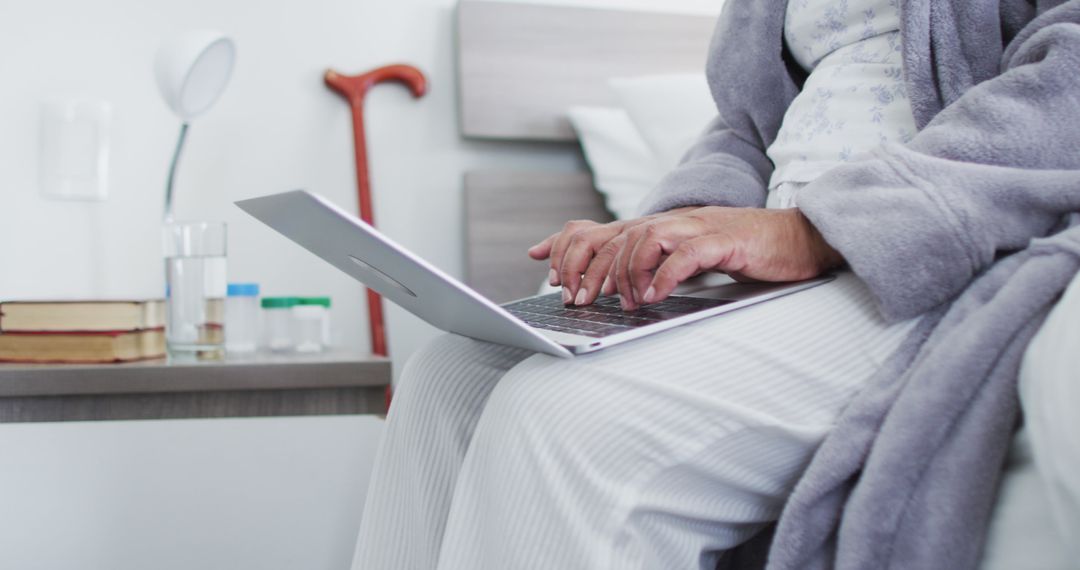 Senior Woman Using Laptop in Bedroom - Free Images, Stock Photos and Pictures on Pikwizard.com