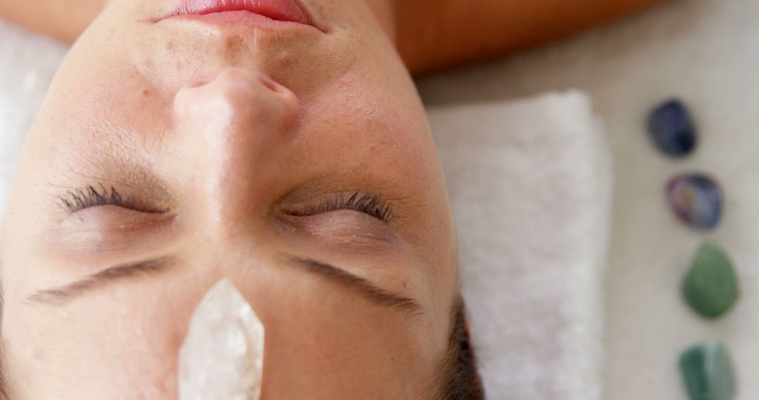 Woman Relaxing Having Crystal Therapy Facial Close-up - Free Images, Stock Photos and Pictures on Pikwizard.com