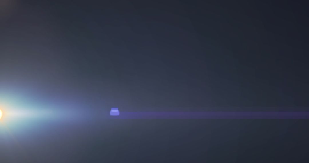 Dynamic Lens Flare with Moving Spotlight Over Dark Background