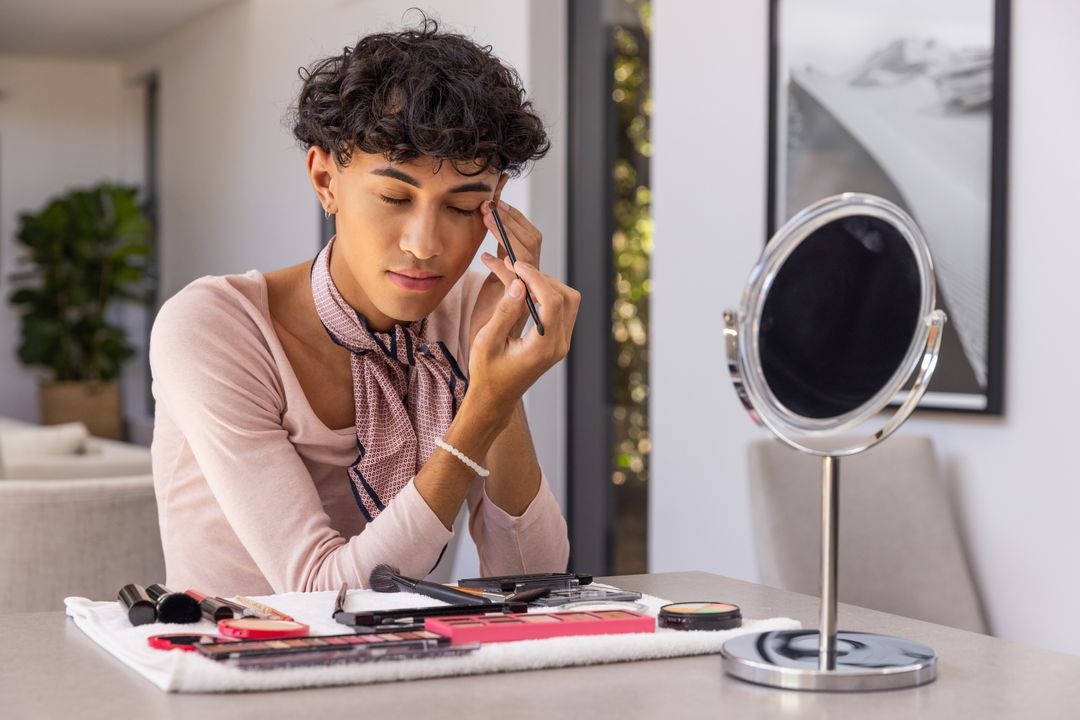 Man Perfecting Eyebrow Make-up at Home with Essential Tools