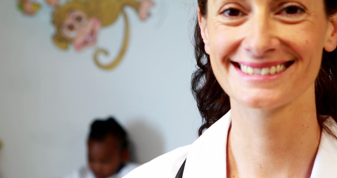 Smiling Female Pediatrician in Medical Clinic - Free Images, Stock Photos and Pictures on Pikwizard.com