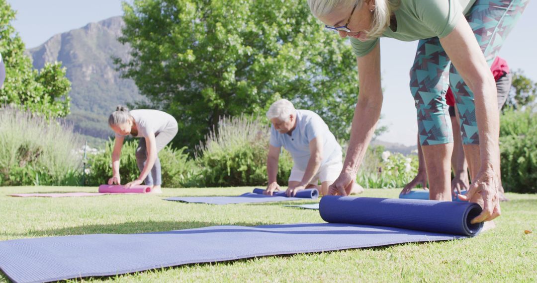 Seniors Practising Outdoor Yoga in Beautiful Mountainous Landscape - Free Images, Stock Photos and Pictures on Pikwizard.com