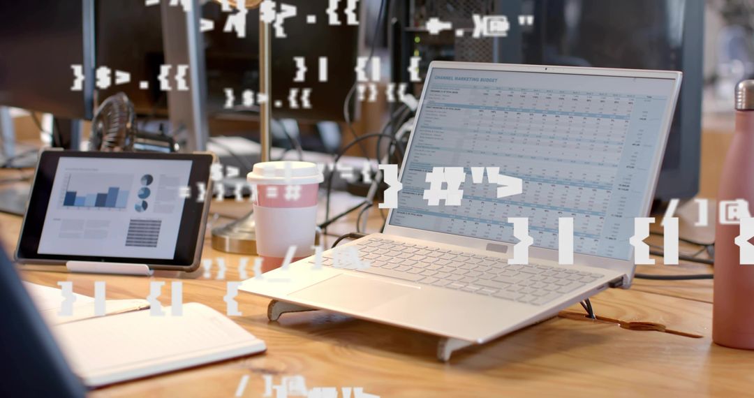 Modern Workspace with Laptop and Analytics Displayed