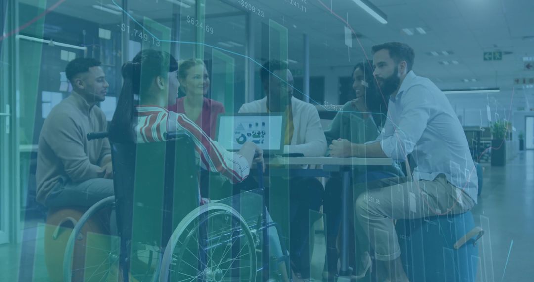 Diverse Team Collaborating with Wheelchair User in Open Office