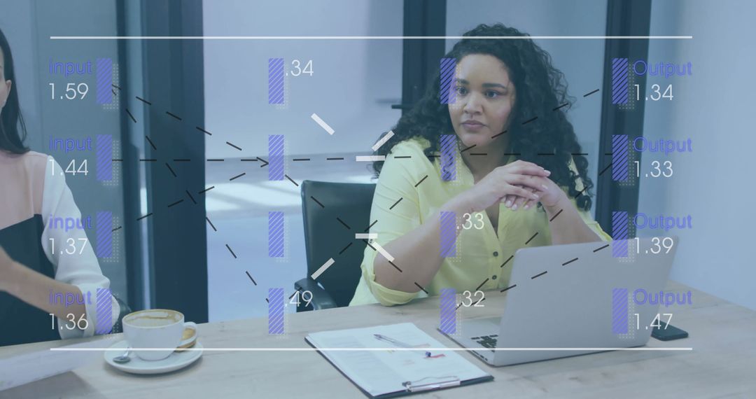 Businesswoman Analyzing Data with Digital Diagrams at Workspace