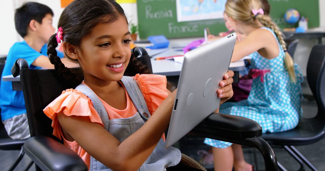 Young Student in Wheelchair Engaging with Tablet in Classroom - Free Images, Stock Photos and Pictures on Pikwizard.com