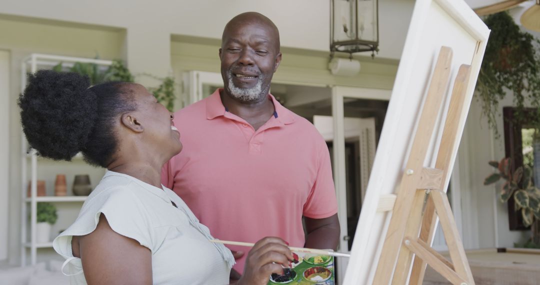 Mature African American Couple Enjoying Painting Together Outdoors - Free Images, Stock Photos and Pictures on Pikwizard.com