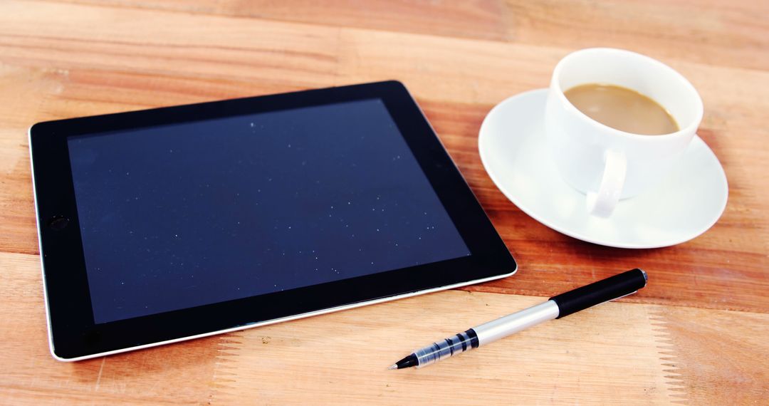 Digital Tablet with Pen and Coffee Cup on Wooden Desk - Free Images, Stock Photos and Pictures on Pikwizard.com