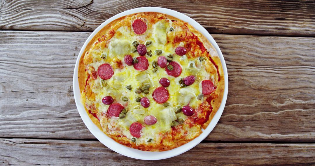 Delicious Pizza with Various Toppings on Rustic Wooden Table - Free Images, Stock Photos and Pictures on Pikwizard.com