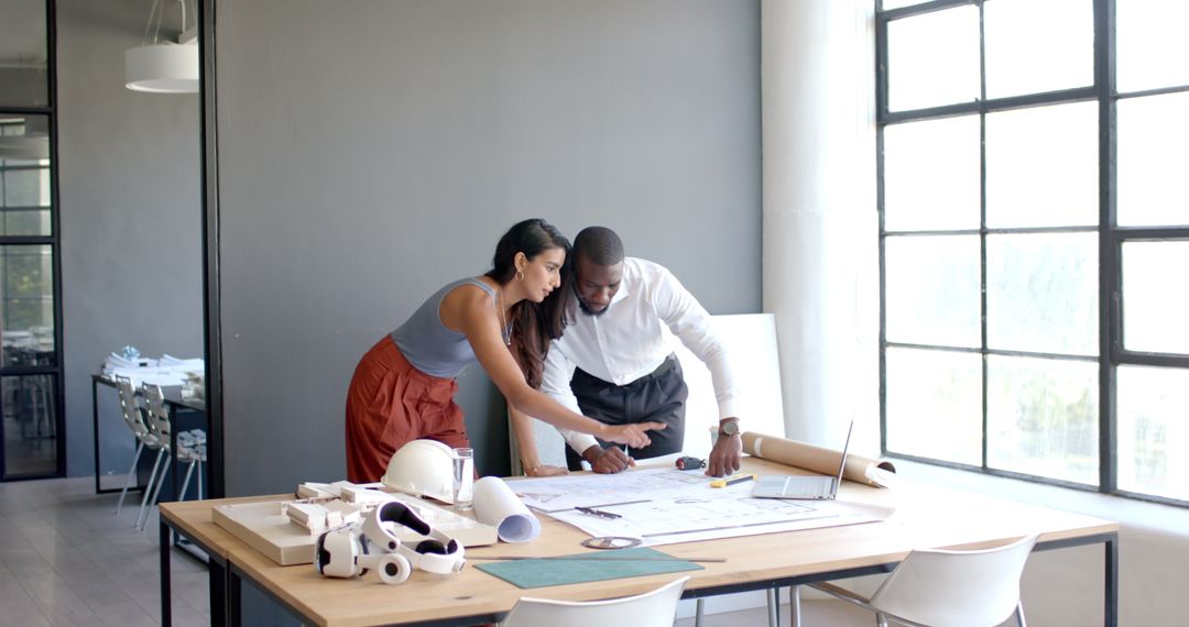 Diverse Business Colleagues Reviewing Architectural Plans