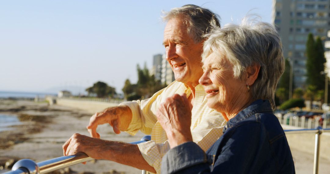 Senior Couple Enjoying Ocean View on Sunny Day - Free Images, Stock Photos and Pictures on Pikwizard.com