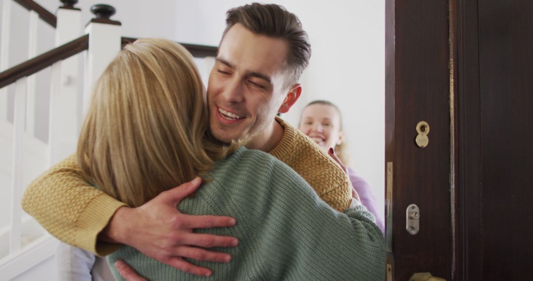 Image of happy caucasian husband and wife hugging with senior parents at their home - Free Images, Stock Photos and Pictures on Pikwizard.com
