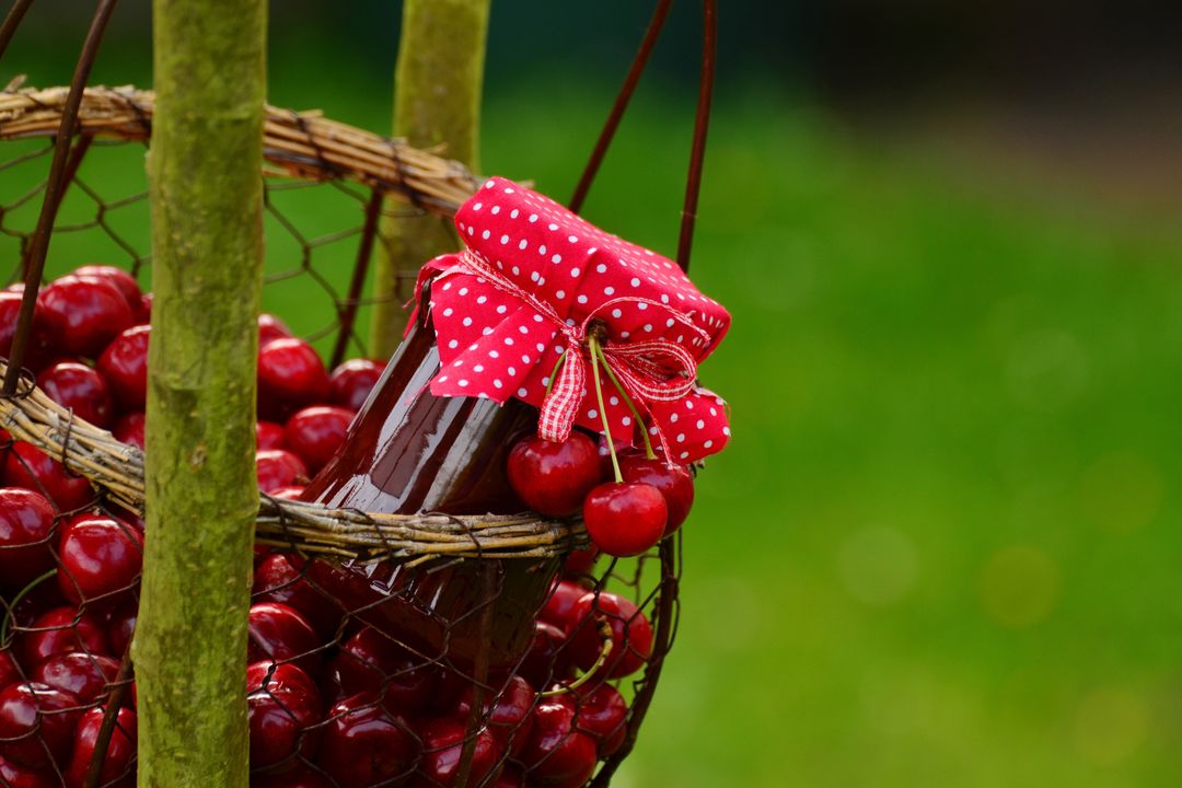 Rustic basket of fresh cherry background with homemade jam