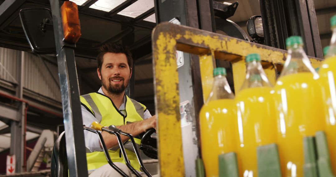 Warehouse Worker Operating Forklift with Beverage Bottles - Free Images, Stock Photos and Pictures on Pikwizard.com