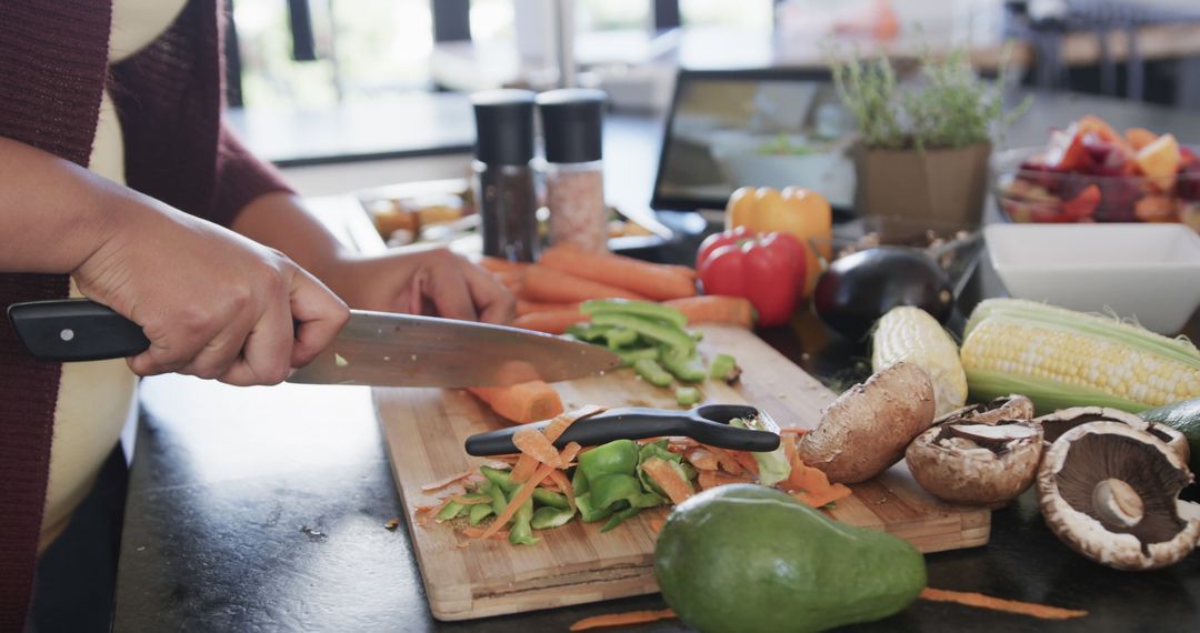 Person Chopping Vegetables in Modern Kitchen - Free Images, Stock Photos and Pictures on Pikwizard.com