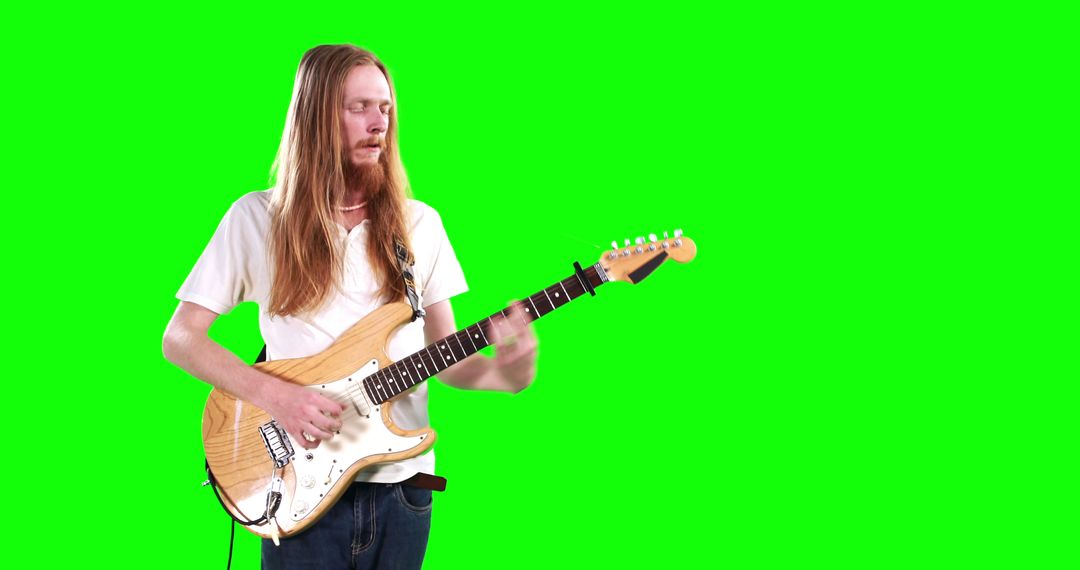 Long-haired Musician Playing Electric Guitar on Green Screen - Free Images, Stock Photos and Pictures on Pikwizard.com