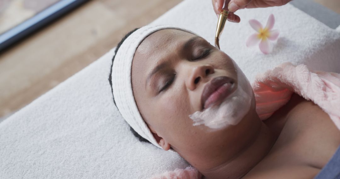 Plus-Size African American Woman Receiving Spa Facial Treatment - Free Images, Stock Photos and Pictures on Pikwizard.com