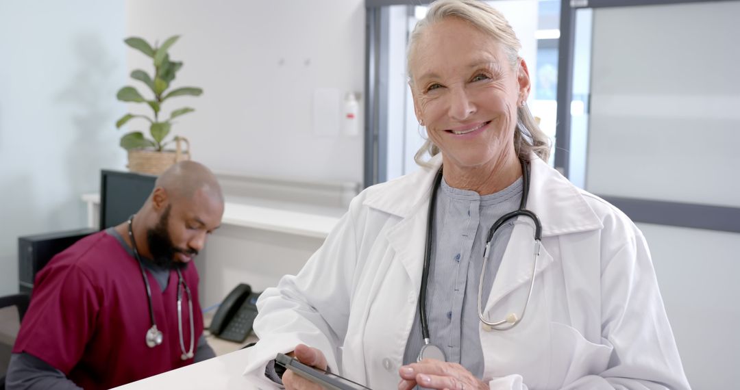 Smiling Female Doctor with Digital Tablet in Modern Hospital - Free Images, Stock Photos and Pictures on Pikwizard.com