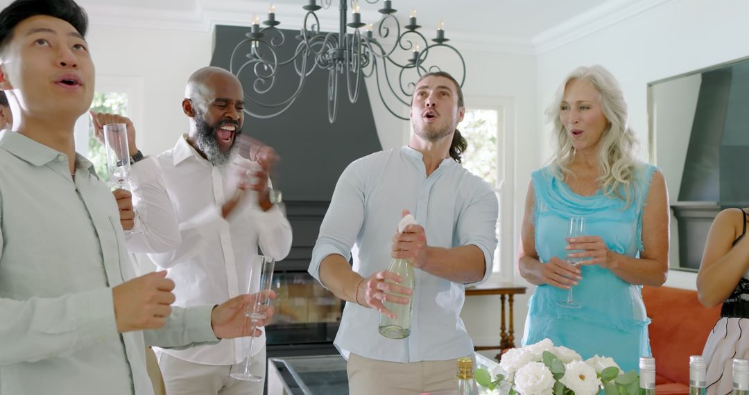 Multigenerational Group Celebrating with Champagne Toast Indoors