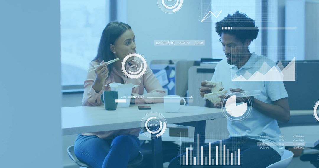 Colleagues Discussing Work During Lunch Break in Modern Office