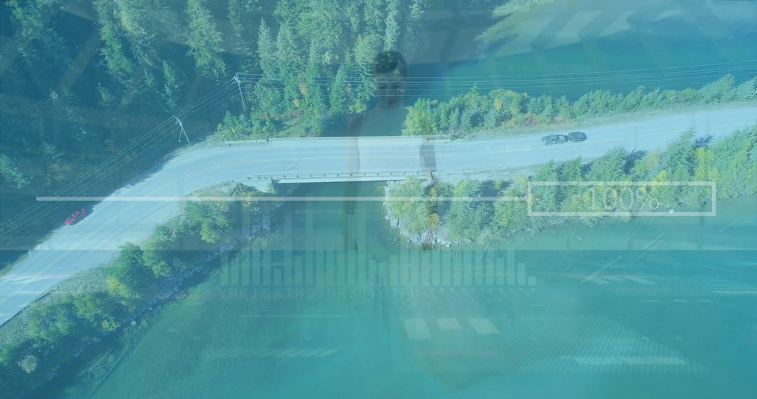 Aerial View of Vehicles Crossing Scenic Evergreen Forest Bridge