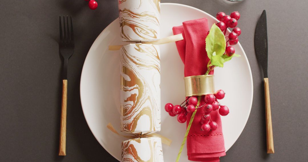 Elegant Christmas Table Setting with Decorative Cracker