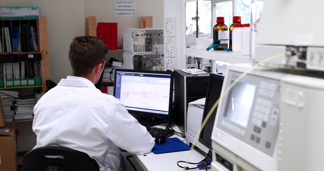 Scientist Analyzing Data on Computer in Laboratory - Free Images, Stock Photos and Pictures on Pikwizard.com