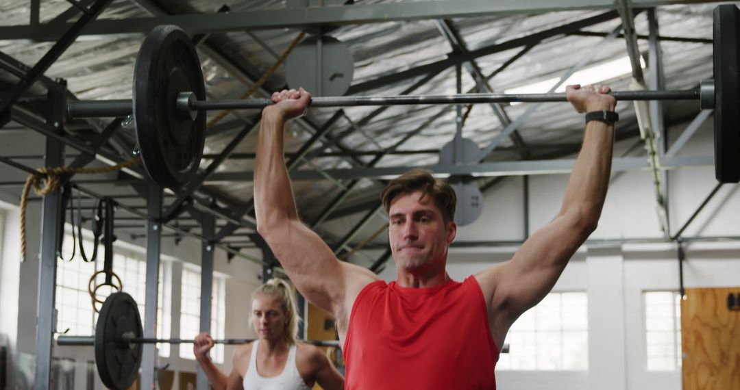 Man Lifting Barbell Overhead in Gym, Intense Workout - Free Images, Stock Photos and Pictures on Pikwizard.com