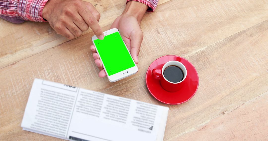 Mobile Phone with Green Screen Mockup on Wooden Table with Coffee - Free Images, Stock Photos and Pictures on Pikwizard.com