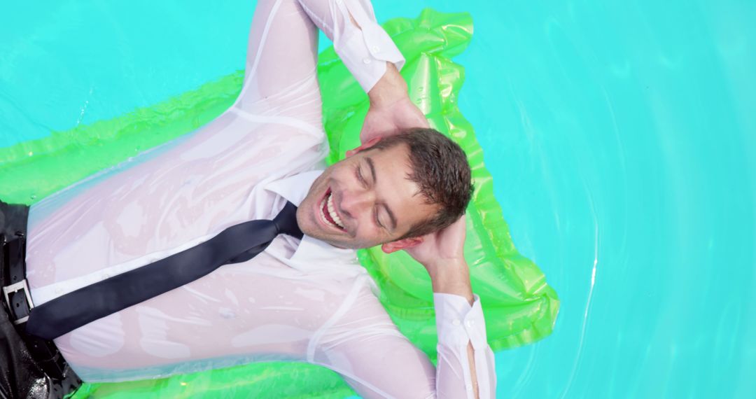 Businessman Relaxing on Green Inflatable in Pool - Free Images, Stock Photos and Pictures on Pikwizard.com