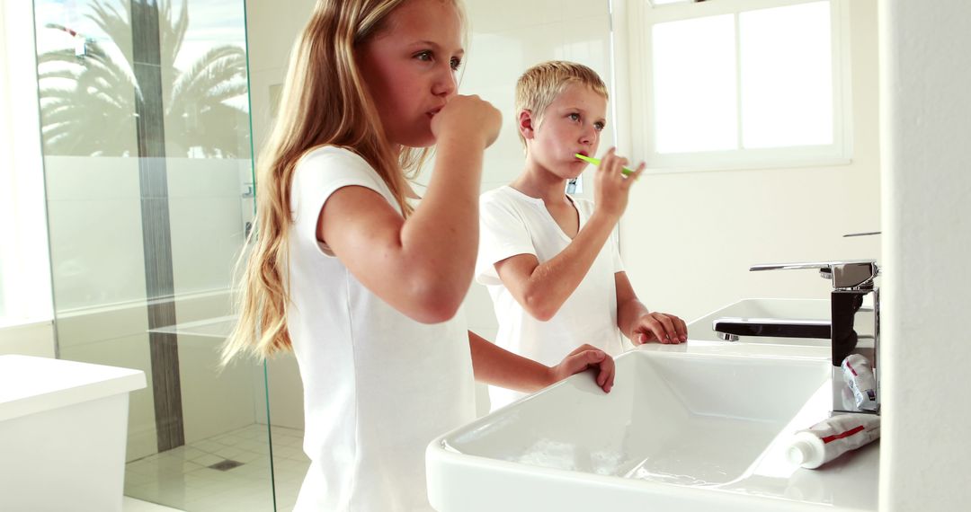 Children Brushing Teeth in Modern Bathroom - Free Images, Stock Photos and Pictures on Pikwizard.com