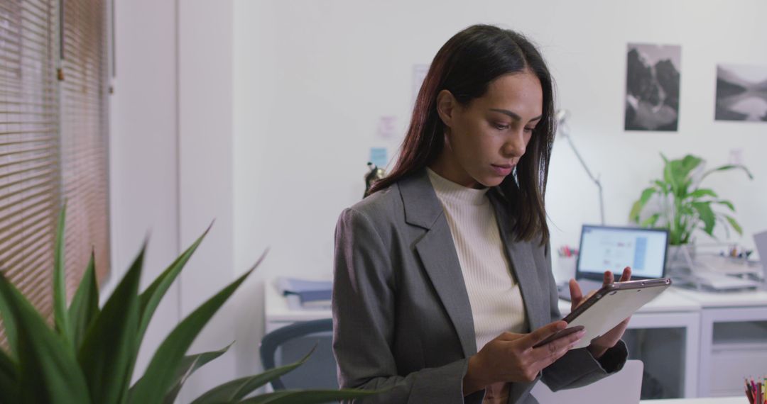 Professional Woman Using Digital Tablet in Office - Free Images, Stock Photos and Pictures on Pikwizard.com