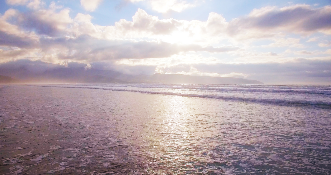 Transparent Tranquil Beach at Sunset with Cloudy Sky and Glittering Waves - Download Free Stock Images Pikwizard.com