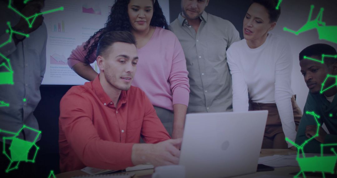 Diverse Team Collaborating on Laptop Presentation in Modern Office