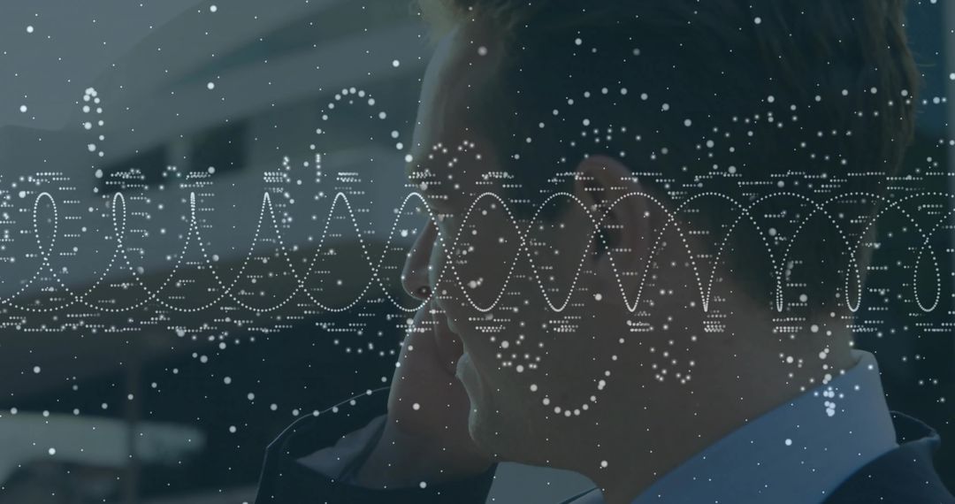 Businessman Engaged in Phone Call with Digital Data Visualization