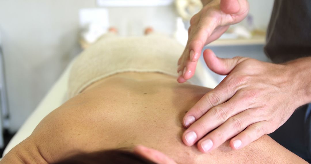 Physiotherapist Massages Client in Relaxing Spa Clinic