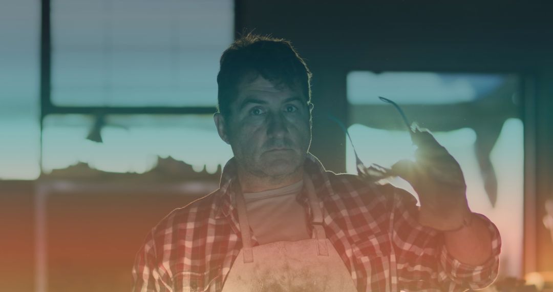 Worker Wearing Safety Goggles in Workshop with Light Spot Effect
