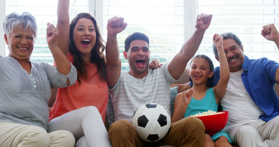 Happy Multigenerational Family Cheering for Soccer Game at Home - Free Images, Stock Photos and Pictures on Pikwizard.com