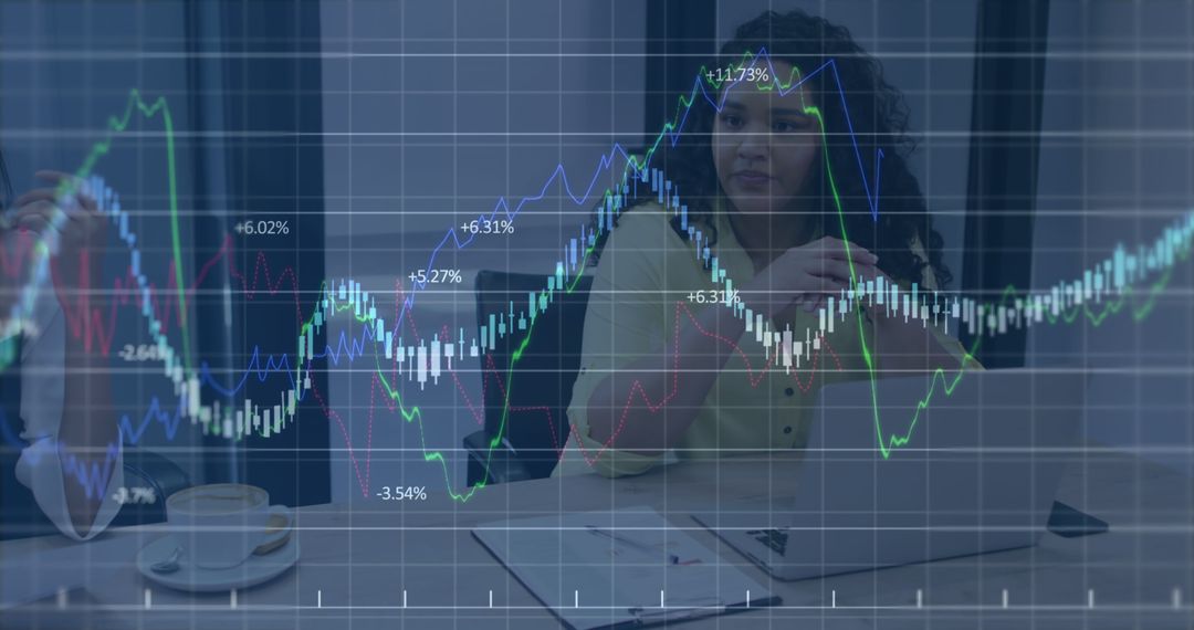 Businesswoman Analyzing Financial Charts on Laptop in Office - Free Images, Stock Photos and Pictures on Pikwizard.com