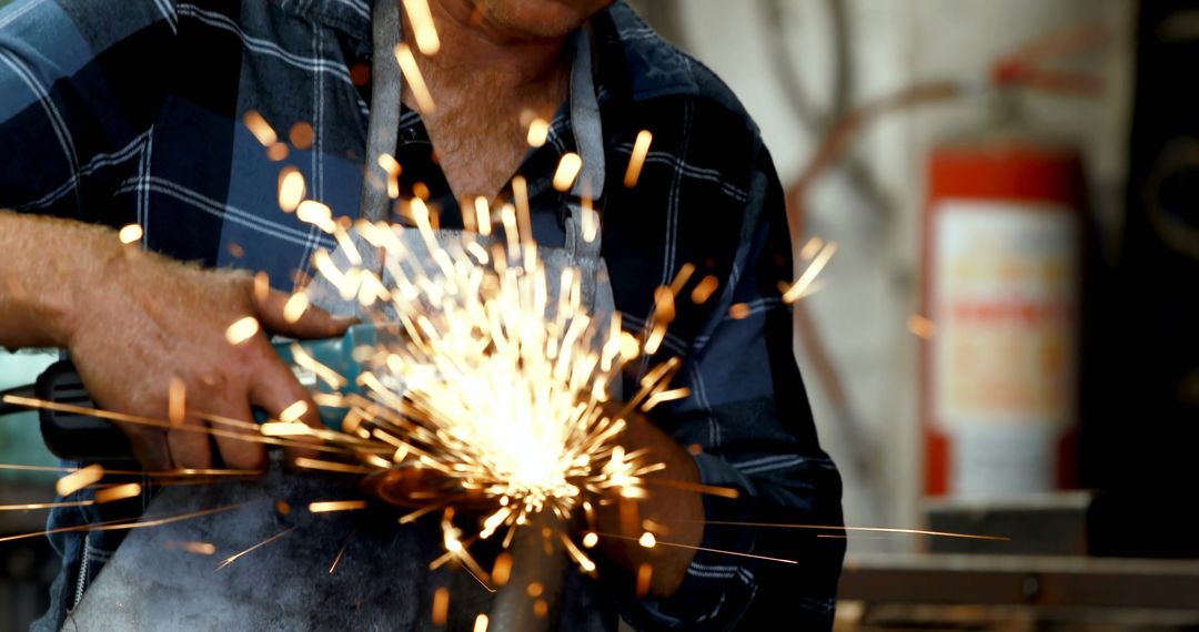 Close-up of Metal Worker Grinding with Sparks Flying - Free Images, Stock Photos and Pictures on Pikwizard.com