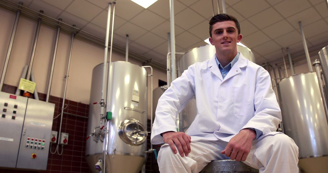 Confident Scientist in Laboratory with Fermentation Tanks - Free Images, Stock Photos and Pictures on Pikwizard.com