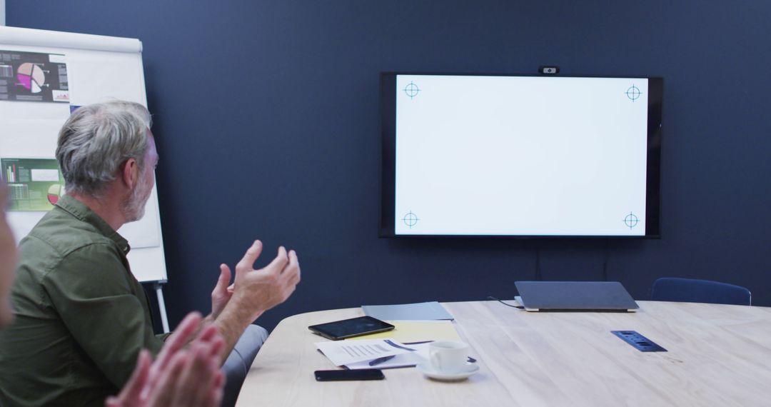 Businessman Applauding During Presentation Meeting in Modern Office - Free Images, Stock Photos and Pictures on Pikwizard.com