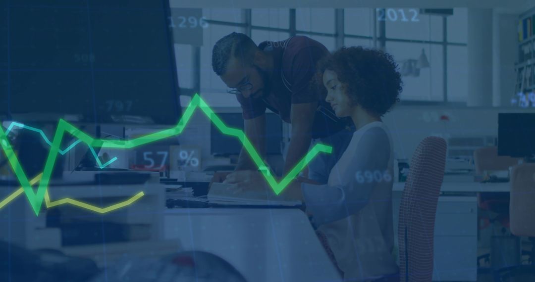 Colleagues Analyzing Data in Modern Open-Plan Workspace