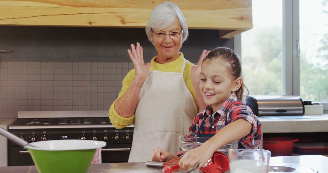 Grandmother Enjoying Baking Cookies with Granddaughter at Home - Free Images, Stock Photos and Pictures on Pikwizard.com