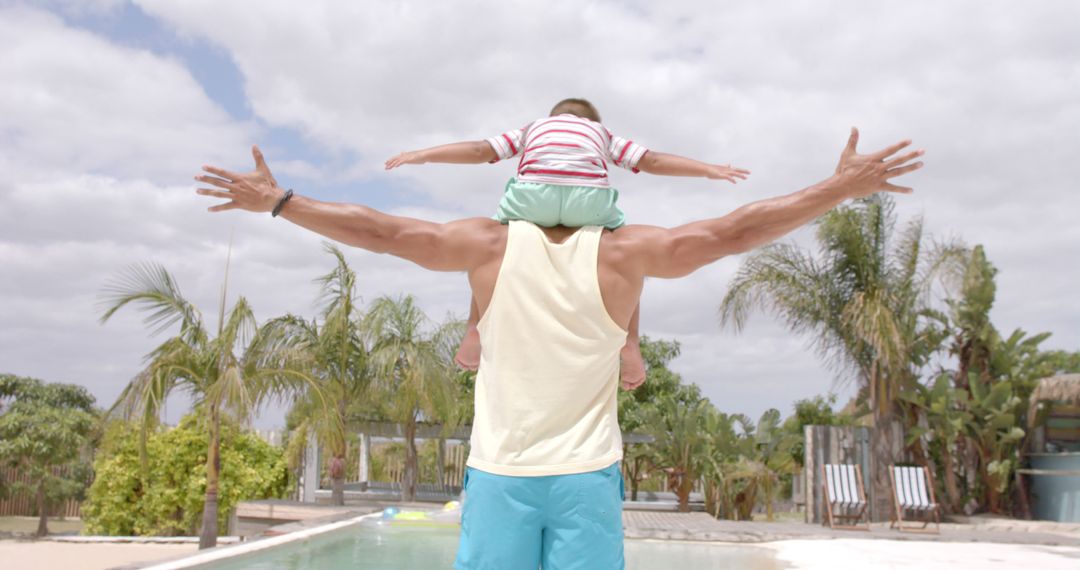 Father and Son Enjoying Summer by Swimming Pool - Free Images, Stock Photos and Pictures on Pikwizard.com