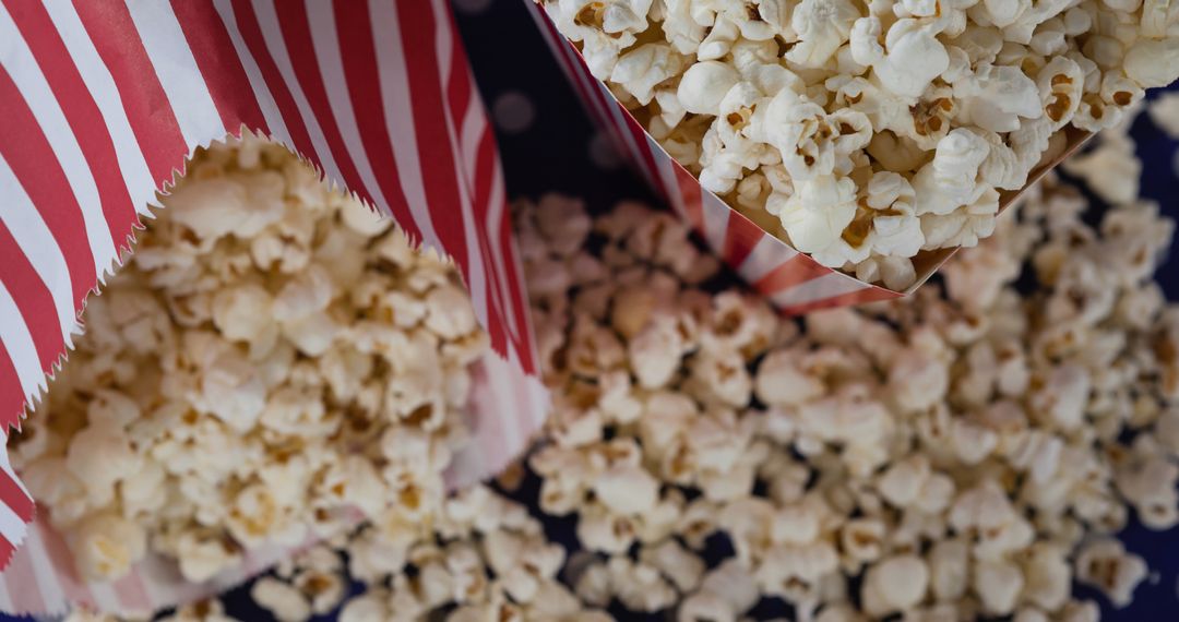 Close-Up of Popcorn Boxes with Spilled Popcorn for National Popcorn Day Celebration - Free Images, Stock Photos and Pictures on Pikwizard.com