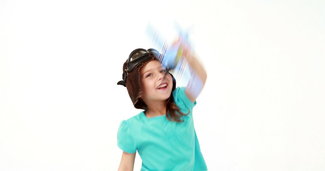 Joyful Child Playing with Toy Airplane in Pilot Hat - Free Images, Stock Photos and Pictures on Pikwizard.com